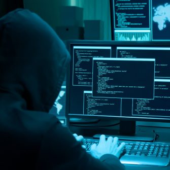 Hacker using a computer to commit a crime